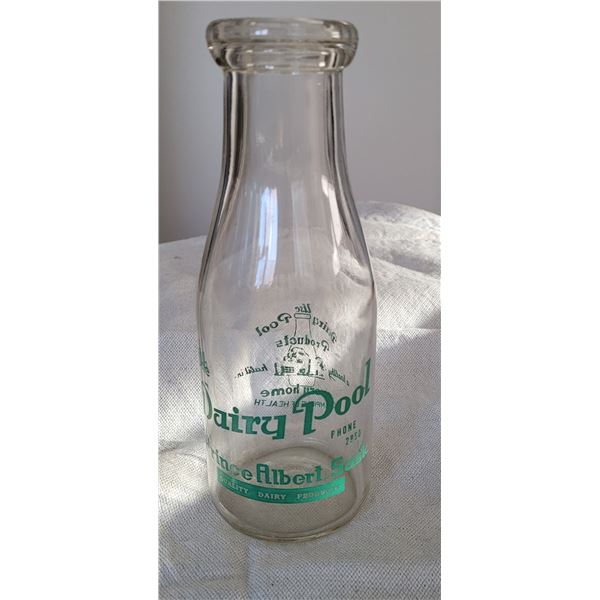 The Dairy Pool, Prince Albert, Sask - 8 1/4 inch tall clear glass bottle with green lettering - base