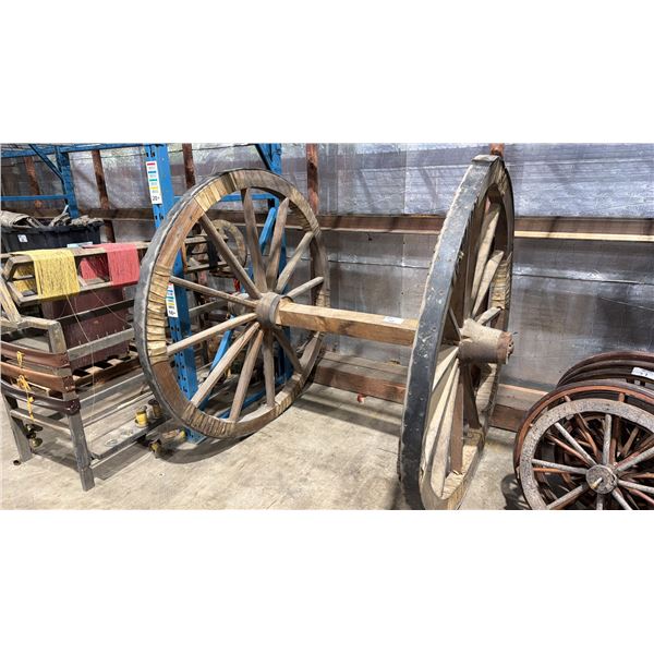 PAIR OF APPROX. 5FT DIAMETER WOODEN WAGON WHEELS WITH AXIL
