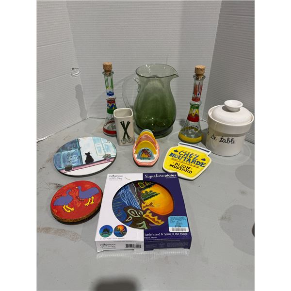 Oil and vinegar bottles, green glass jug, and other kitchen items