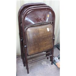 Lot 4 folding brown chairs with padded seeats