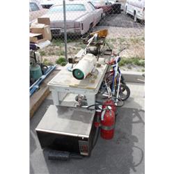 Workbench with tools, bikes, scooters