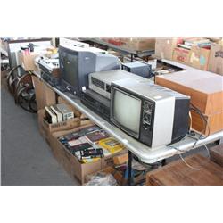 Lot of old electronics, books, and videos
