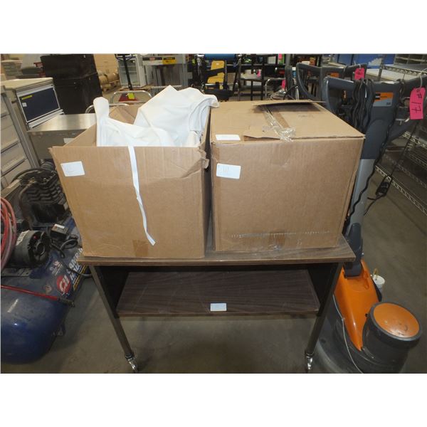 2 Boxes Of White Isolation Gowns & 1 Small Table On Wheels