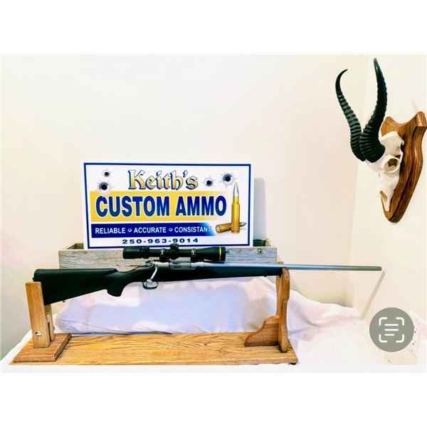 Winchester model 70 with mounted Leupold VX3 3.5-10x40 scope and 50 rounds of custom ammo