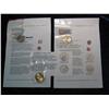 597. Three Different Coins of the Month Dollar Coins. Gem BU with literature.