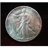 665. 1945 D Walking Liberty Half Dollar. AU 50.