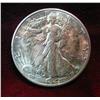 667. 1944 D Walking Liberty Half Dollar. Toned AU+