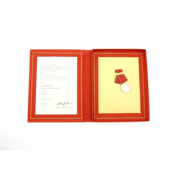 EAST GERMAN MEDAL OF MERIT OF THE NATIONAL PEOPLE'S ARMY WITH CERTIFICATE AND PRESENTATION BOX