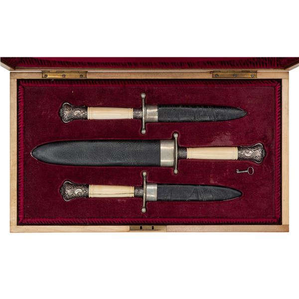 CASED SET OF THREE REPRODUCTION BOWIE KNIVES.