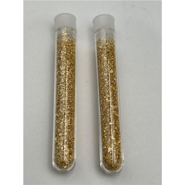 Two Plastic Vials Containing Gold-Colored Flakes