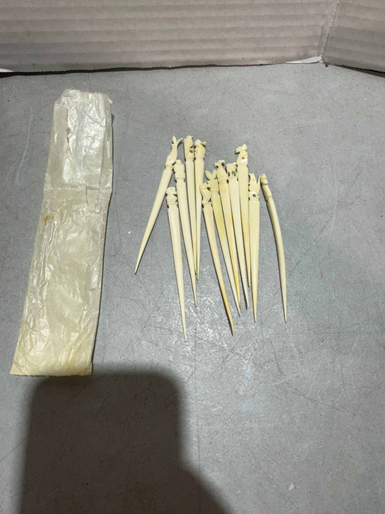 hand-carved bone or ivory toothpicks