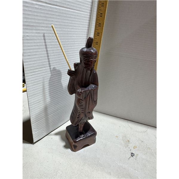 vintage Asian hand-carved wood figurine depicting a fisherman or wise man.