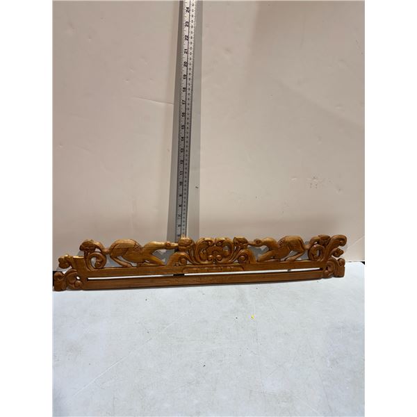 Indonesian carved wood textile hanger.