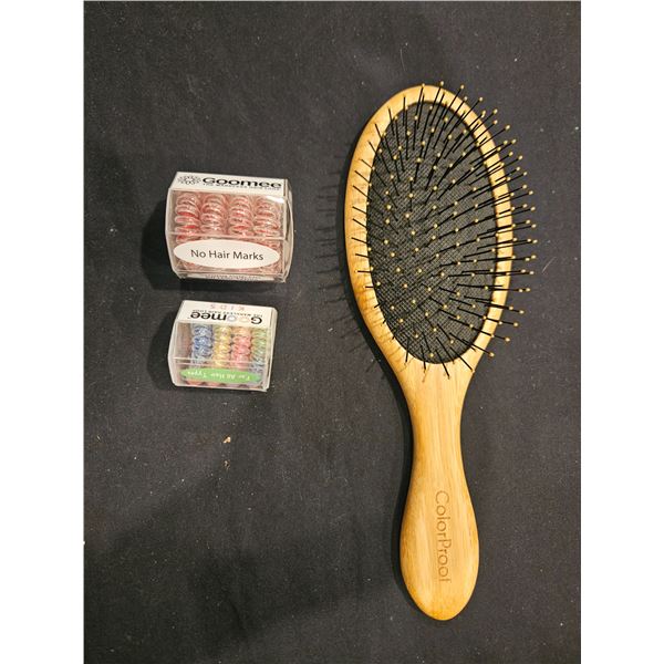 wooden brush and hair elastics