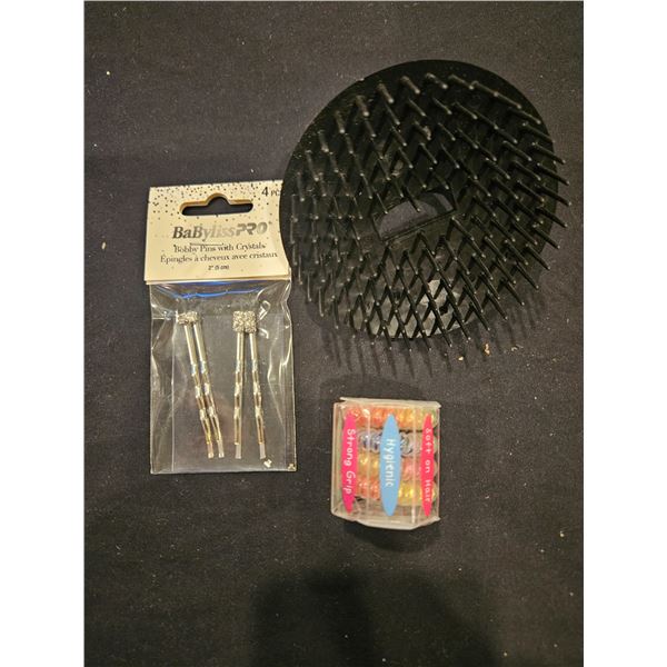scalp brush, bobby pins and hair elastics