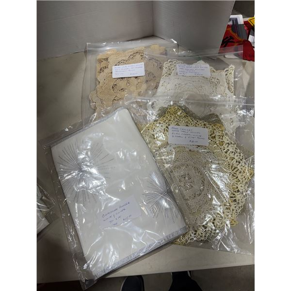 Assorted hand, crocheted, doilies, and Christmas white in silver runner