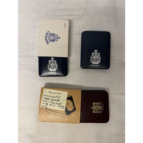 3 CANADIAN UNCIRCULATED CASED DOLLARS 1970 MANITOBA, 1973 PEI, 1976