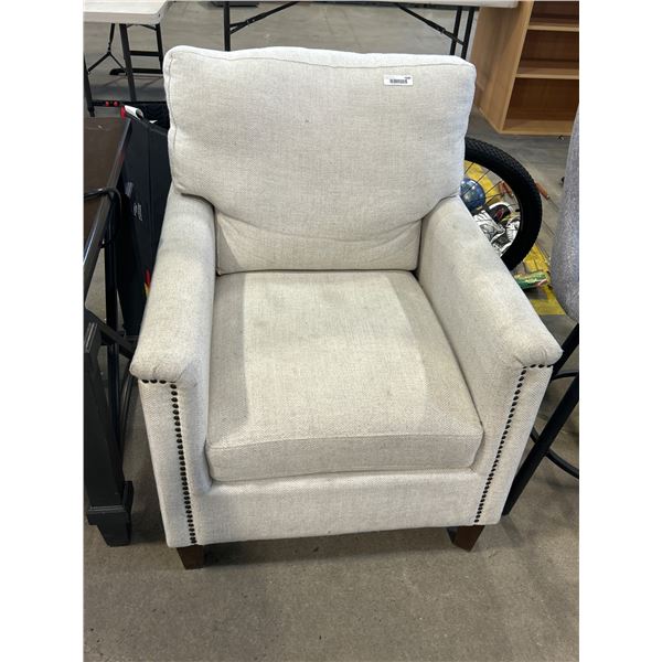 Upholstered Armchair With Nailhead Trim and Wooden Legs