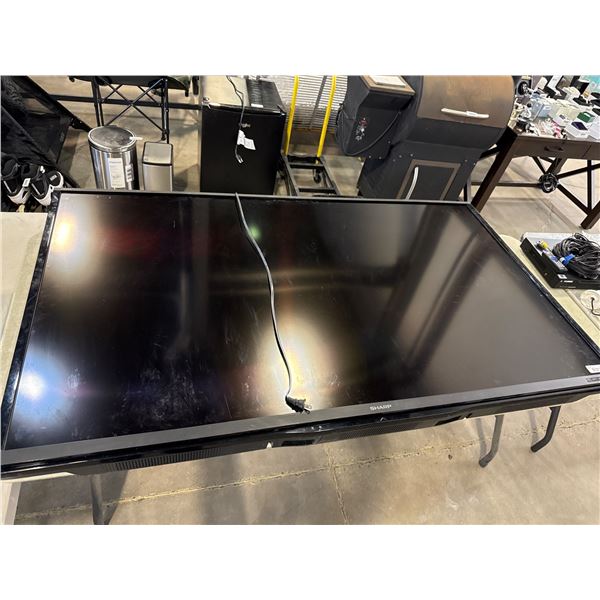 Sharp 70 inch television with lorex security components and wall mount