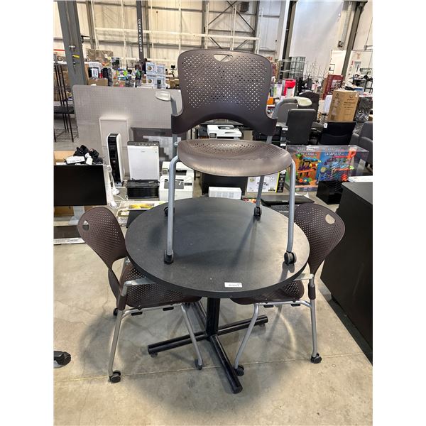 3 Brown Armchairs with Perforated Backs and 1 Round Table