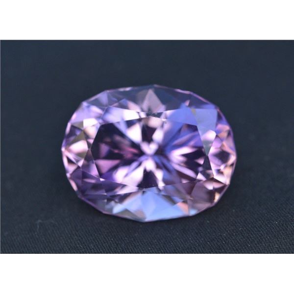 One loose collector's stone with the following: Natural Purple Amethyst, faceting style: Oval Cut Nu