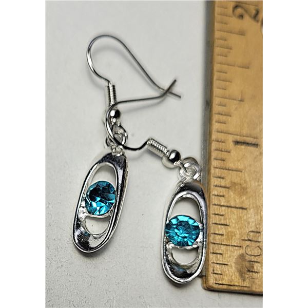 18)  SILVER TONE WITH TOPAZ BLUE CRYSTAL