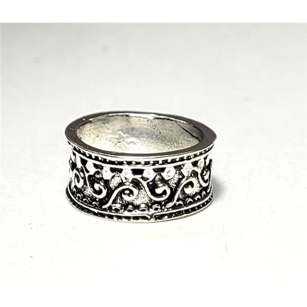 23) HEAVILY CARVED SILVER TONE SIZE 4 RING.