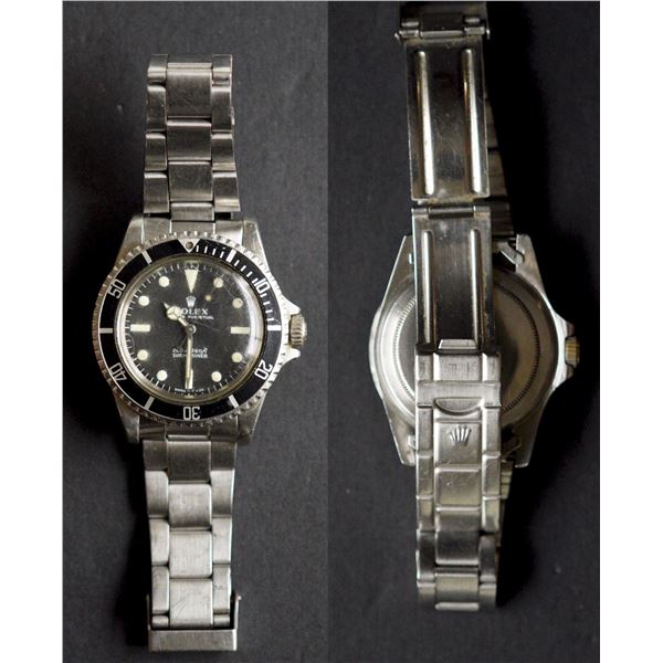 Rolex Oyster Perpetual. No-Date Submariner.  Stainless steel Submariner wristwatch. With black "Mete