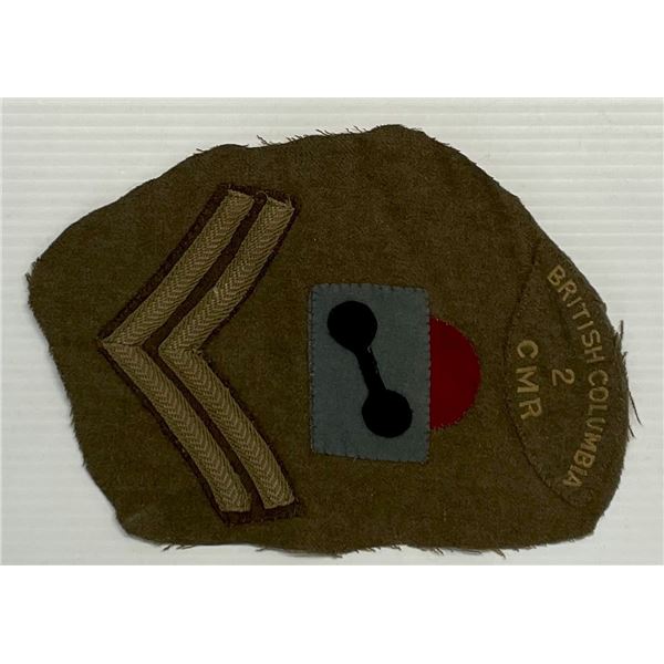 Militaria Insignia;  WW2 British Columbia 2 CMR w/Corporal rank.  Cut off portion of upper arm tunic