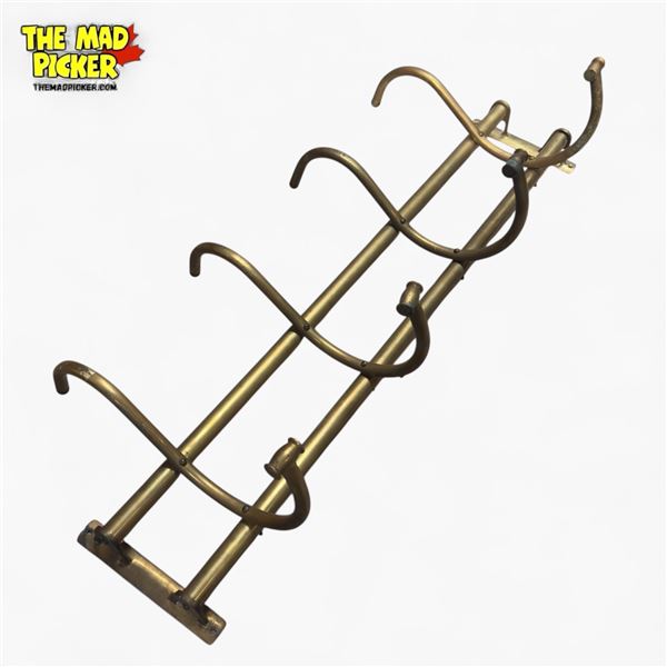 Vintage Brass Wall-Mount Coat Rack with Four Hooks.