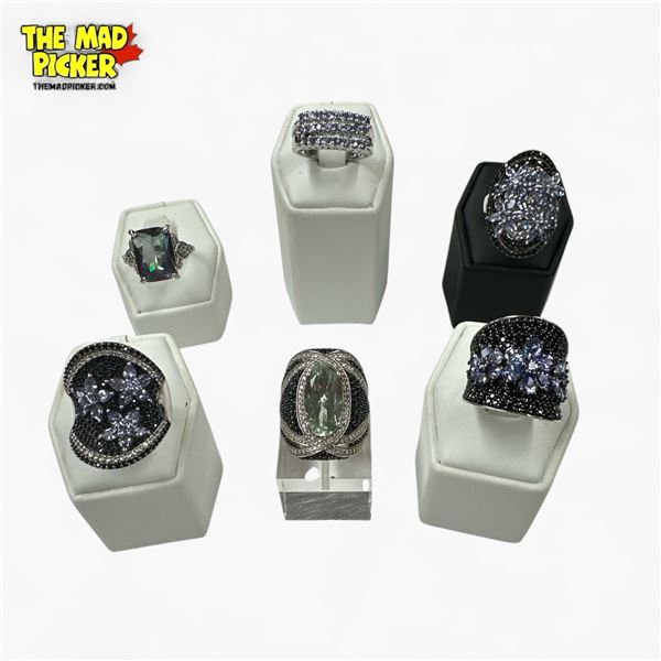 5 New Blue & 1 Mystic Topaz Rings in Silver Settings (all stamped .925) Total weight: 60.8 grams