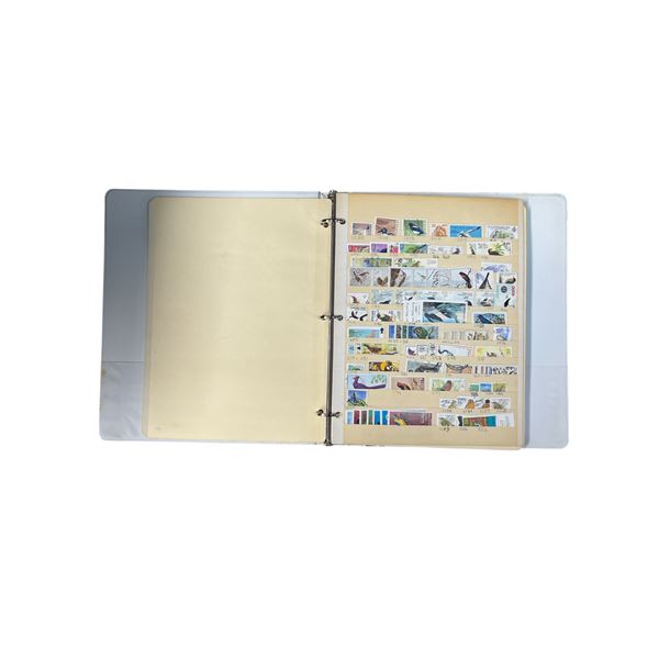 Stamps in Album Organized by: Space, Birds, Seasons, Ships, Etc.