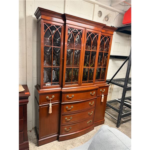 Beautiful two-piece China cabinet measures 56 1/2 inches long  16 inches deep