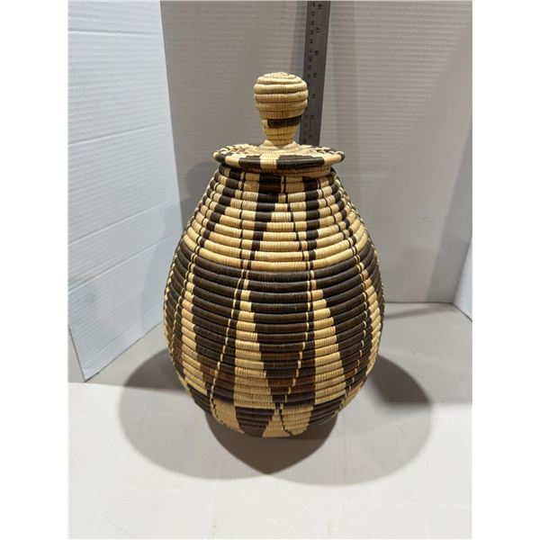 Zulu Ukhamba, a traditional handwoven lidded basket