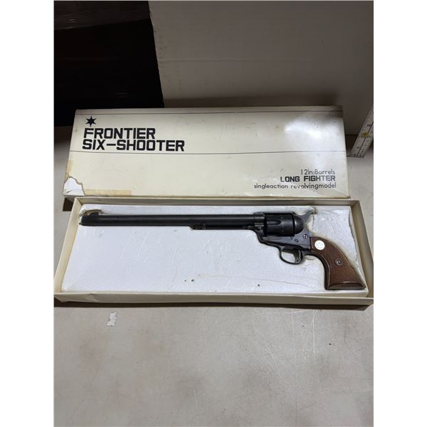 12 inch barrel, long fighter single action, revolving model six shooter