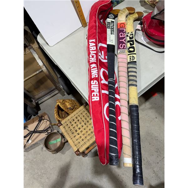 Field hockey sticks and shin pads