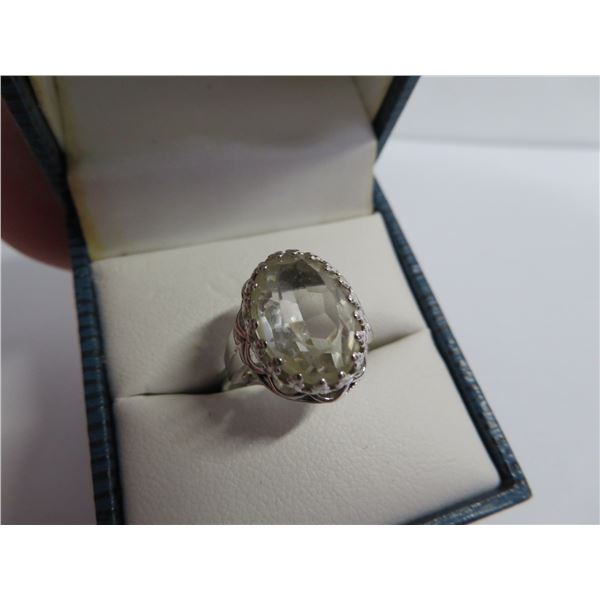 STERLING vintage ring with clear stone.  Approx size 7.  Marked STERLING on band