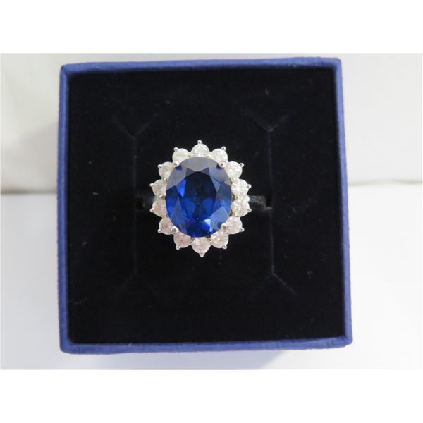 925 Silver Princess Diana style ring. Beautiful and vibrant blue stone. Appr size 5.5-6.  Marked 925