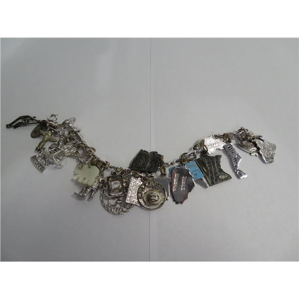 Sterling vintage charm bracelet with tons of charms (my quick count was 24).