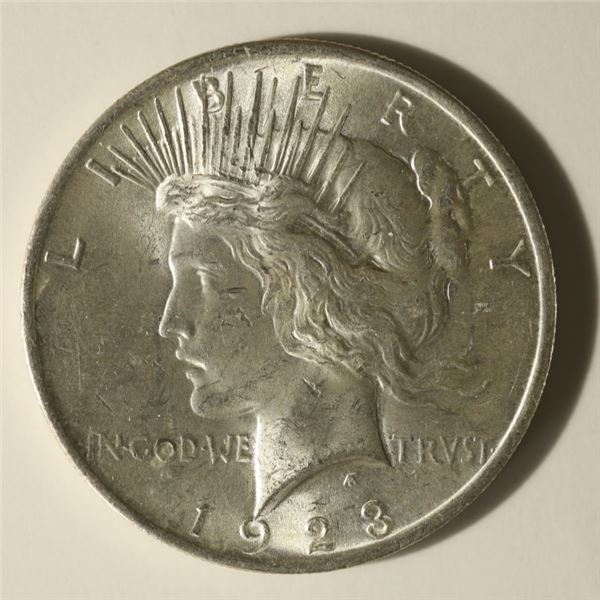 1923 PEACE SILVER DOLLAR. UNC