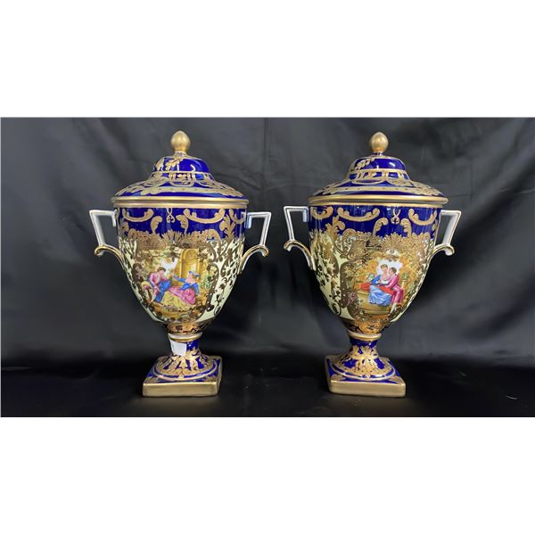 PAIR OF 14" GERMAN PORCELAIN LIDDED URNS WITH PAINTED CARTOUCHES