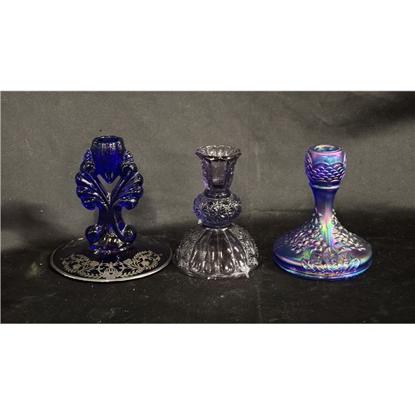 (3) ASSORTED CANDLE HOLDERS: 1 COBALT, 1 AMETHYST PRESSED GLASS & 1 FENTON COBALT CARNIVAL GLASS