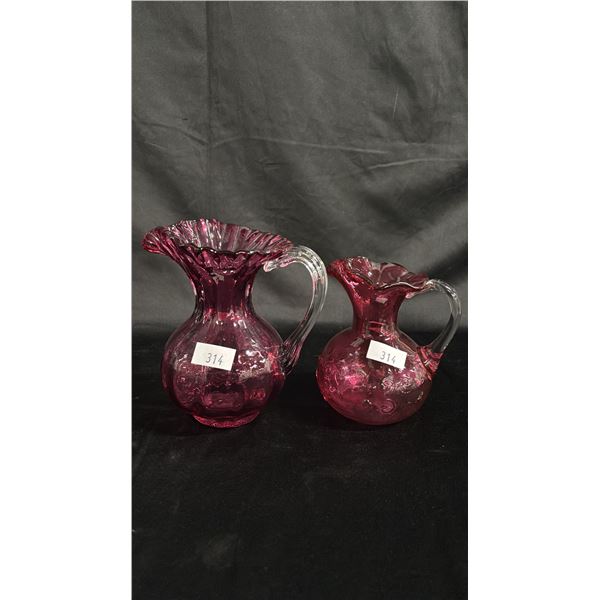 (2) CRANBERRY GLASS PITCHERS: TALLEST IS 7"