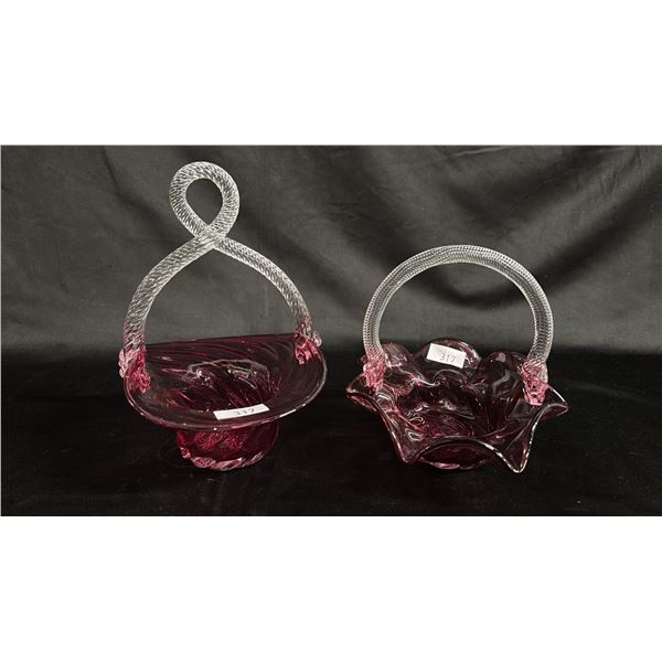 (2) CRANBERRY GLASS BASKETS WITH CLEAR TWISTED ROPE HANDLES: TALLEST IS 9.5"
