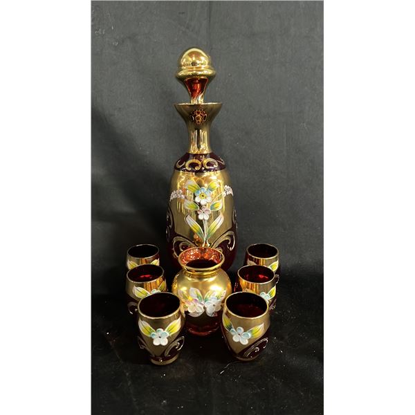 VINTAGE GILDED RUBY GLASS DECANTER SET WITH BUD VASE: ALL ARE PAINTED W/ENAMEL FLOWERS