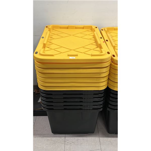 STACK OF (7) LARGE BLACK TOTES WITH YELLOW LIDS
