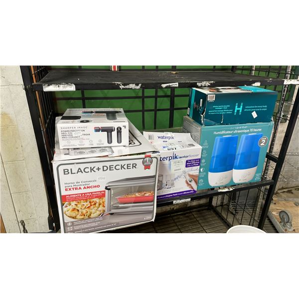 SHELF OF ASSORTED ITEMS INCLUDING; SHARPER IMAGE POWER PERCUSSION PRO+ MASSAGER, WATERPIK