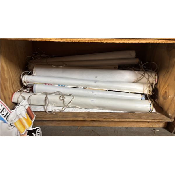 SHELF OF ASSORTED COORS LIGHT POSTERS & BANNERS