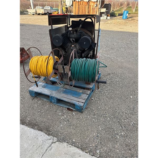 portable industrial air compressor system with hose reels.