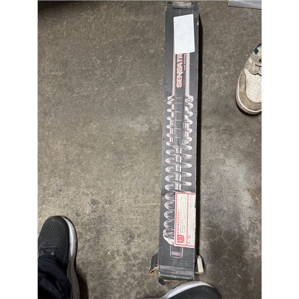 Loaded, adjusting shock absorber